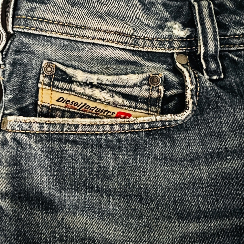 Diesel Blue Jeans with Contrast Stitching and Distressed Details